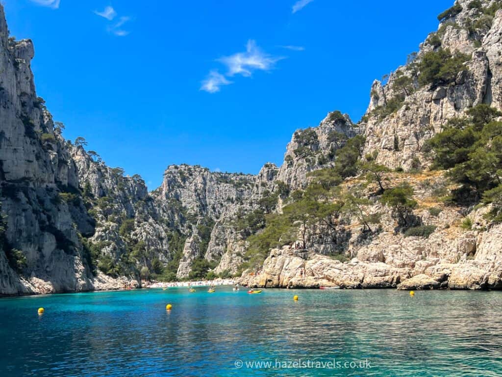 Steep cliffs and a beach seen from the water at Cassis Calanques, south of france.