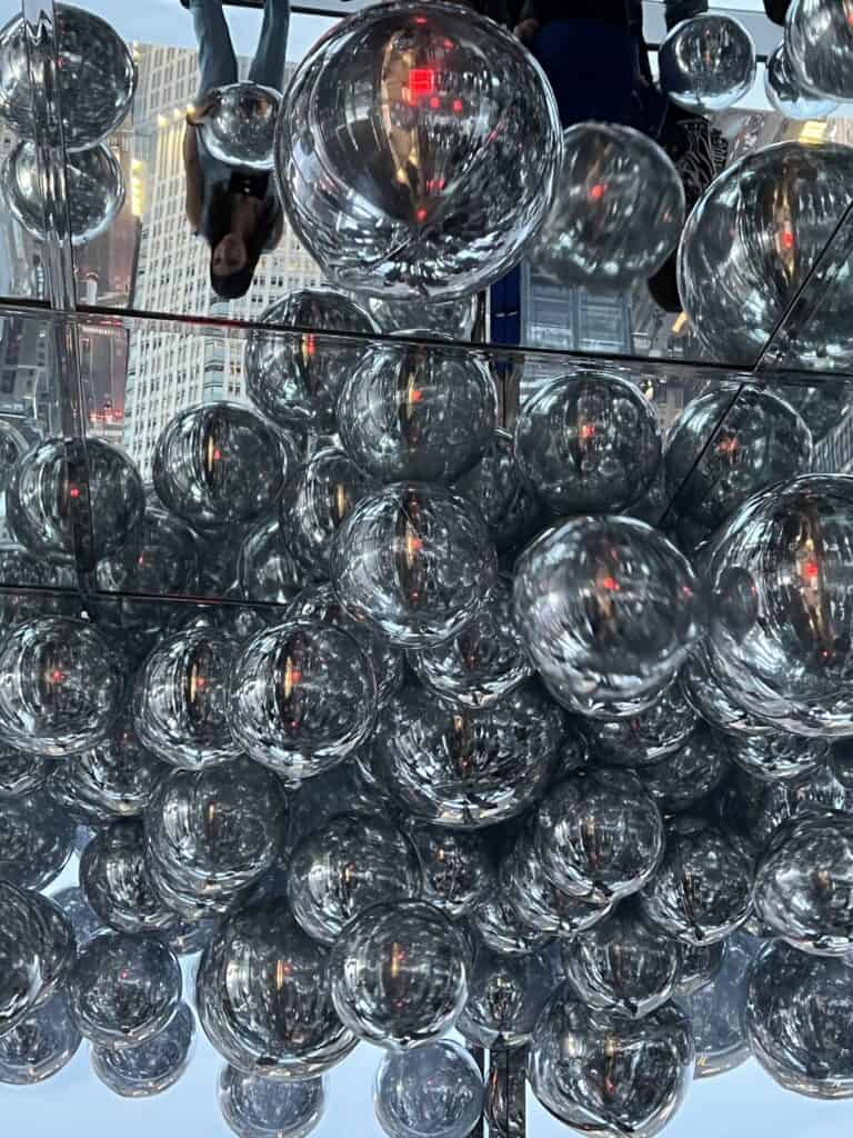 Silver balloons with a reflective background 