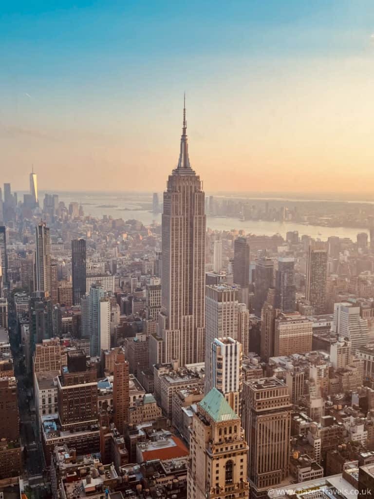 View of the Empire State building from Summit One Vanderbilt  NYC observation deck in NYC at sunset. 
