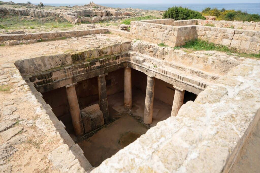 Square cutout into an underground tomb supported by ancient columns, in Cyprus
