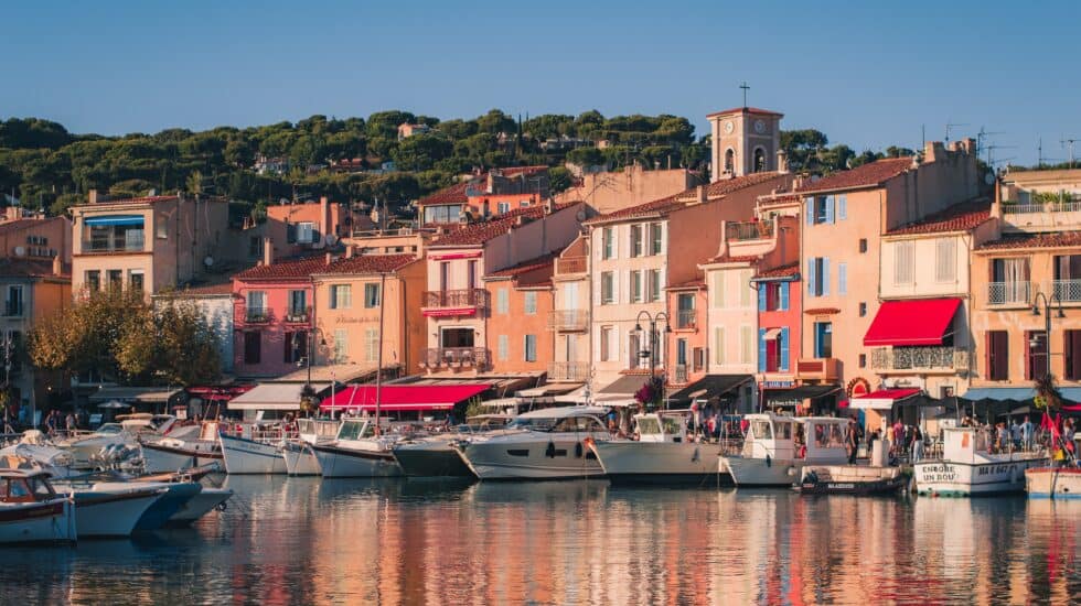 The port village of Cassis, South of France, Provence. Pastel houses and boats as seen from the water.