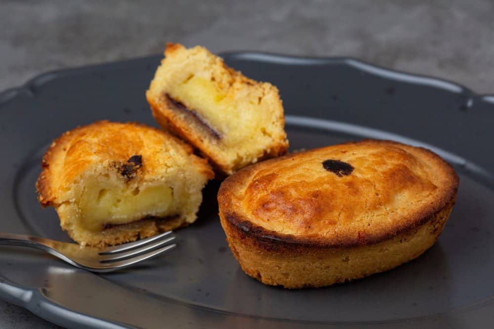 a plate with some food on it and a fork.Pasticciotto