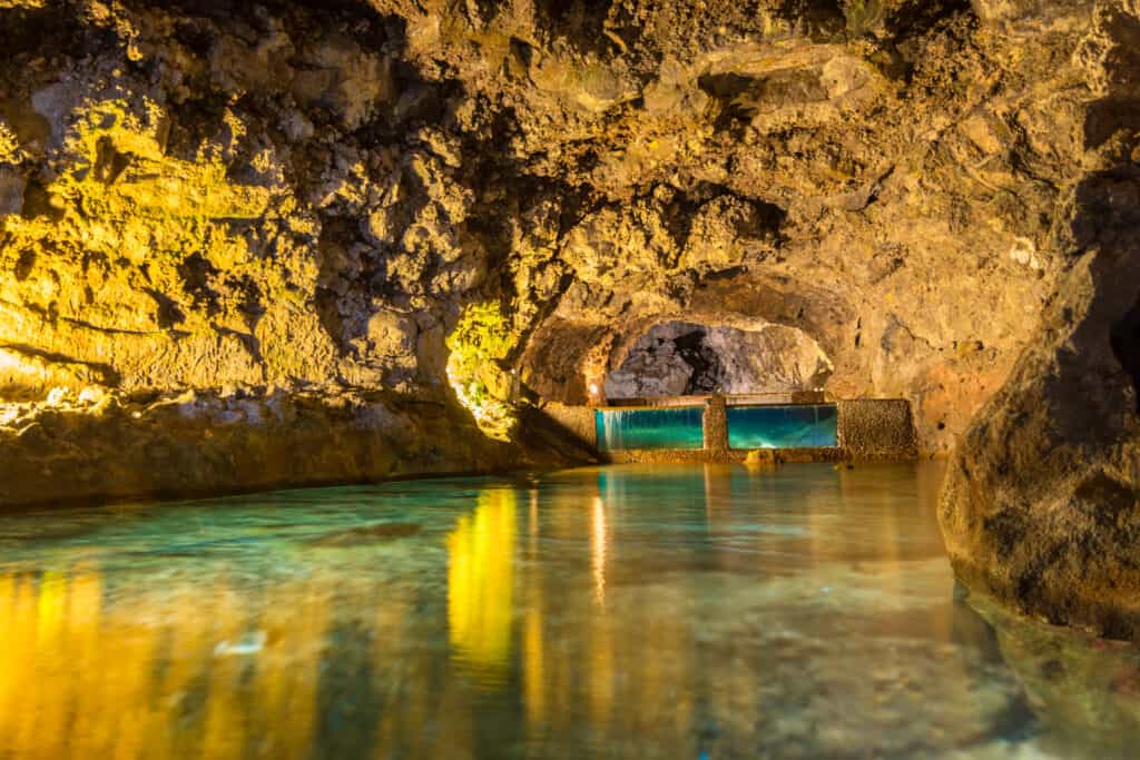 A cave with water flowing through it.