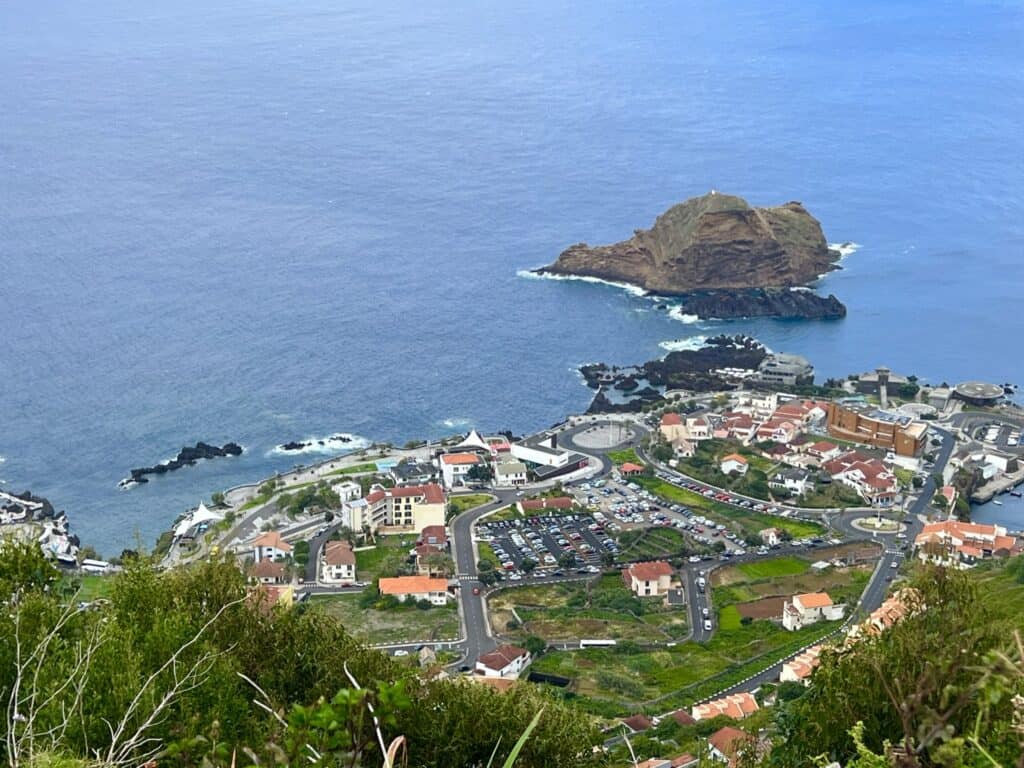 An aerial view of the town of Porto Moniz near the ocean.