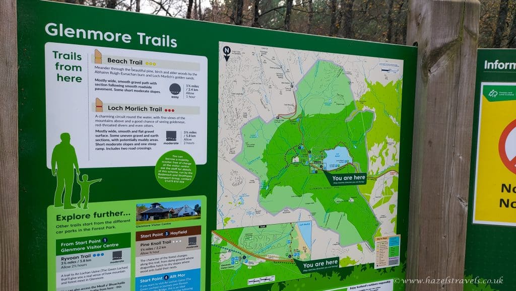 Map display of Glenmore Trails featuring Beach Trail and Loch Morlich Trail, with detailed routes and information, including a "You are here" marker.