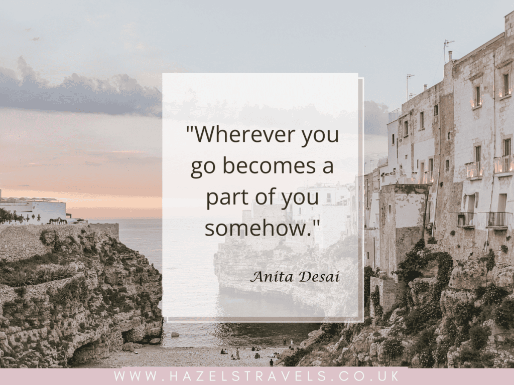 Quote over coastal scene with cliffside buildings at sunset. Text says: "Wherever you go becomes a part of you somehow." - Anita Desai. Website: www.hazelstravels.co.uk at the bottom.