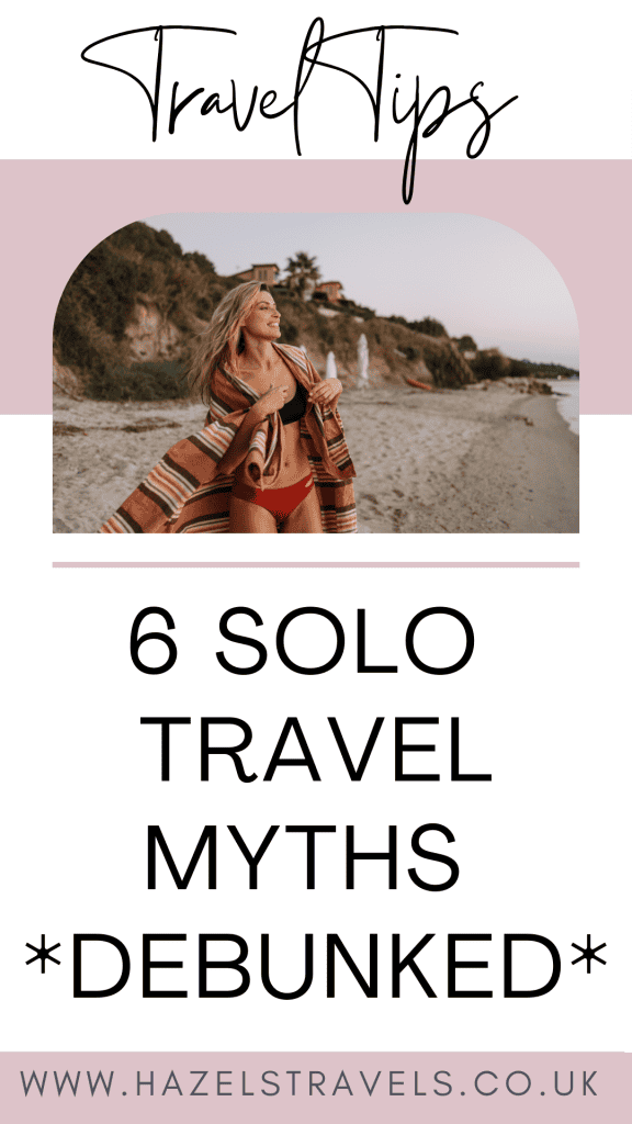 Woman in swimwear with a shawl on a beach, walking in front of cliffs. Text: "Travel Tips: 6 Solo Travel Myths Debunked." Website: www.hazeltravels.co.uk.