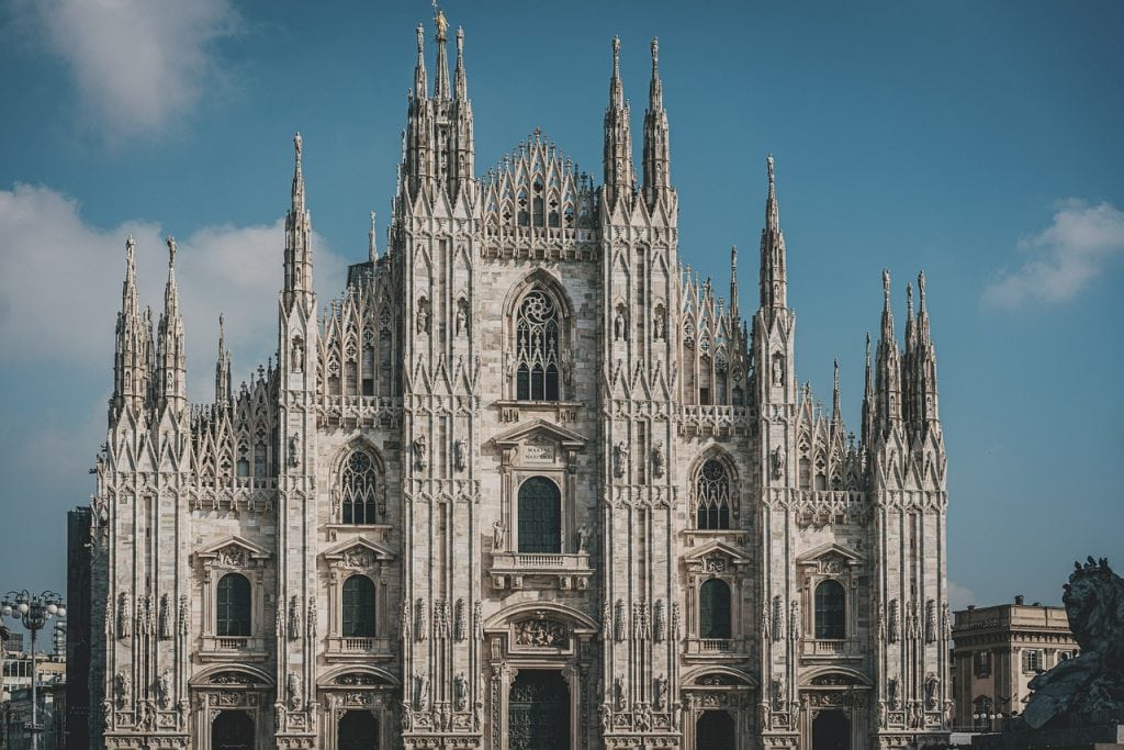 Majestic Milan Cathedral (Duomo di Milano), Gothic architecture, iconic landmark in Italy, stunning marble facade, intricate detailing, popular travel destination in Europe.