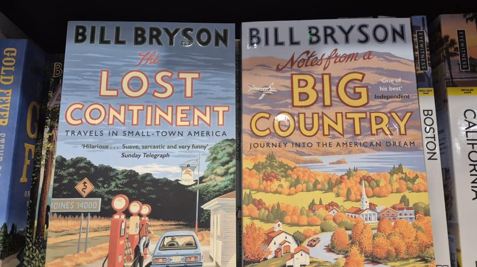A pair of colourful travel books by Bill Bryson, focusing on American travel and landscapes. Perfect for readers interested in exploring small-town America, the American dream, and travel adventures.