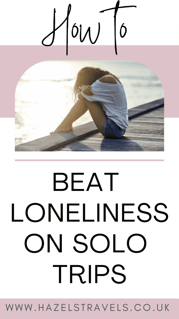 Woman sitting on a dock with text: "How to Overcome Loneliness When Travelling Solo." Website: hazelstravels.co.uk.