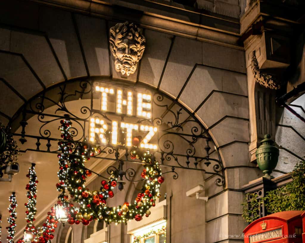 The Ritz 5 star hotel in London entrance decorated with Christmas wreaths and festive lights
