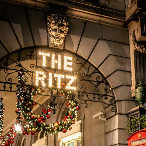 The Ritz 5 star hotel in London entrance decorated with Christmas wreaths and festive lights