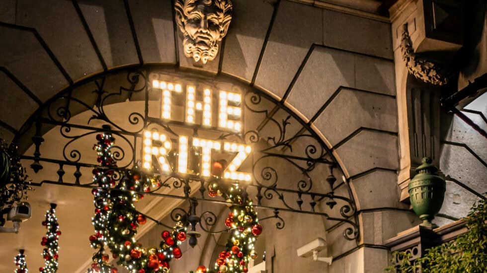 The Ritz 5 star hotel in London entrance decorated with Christmas wreaths and festive lights