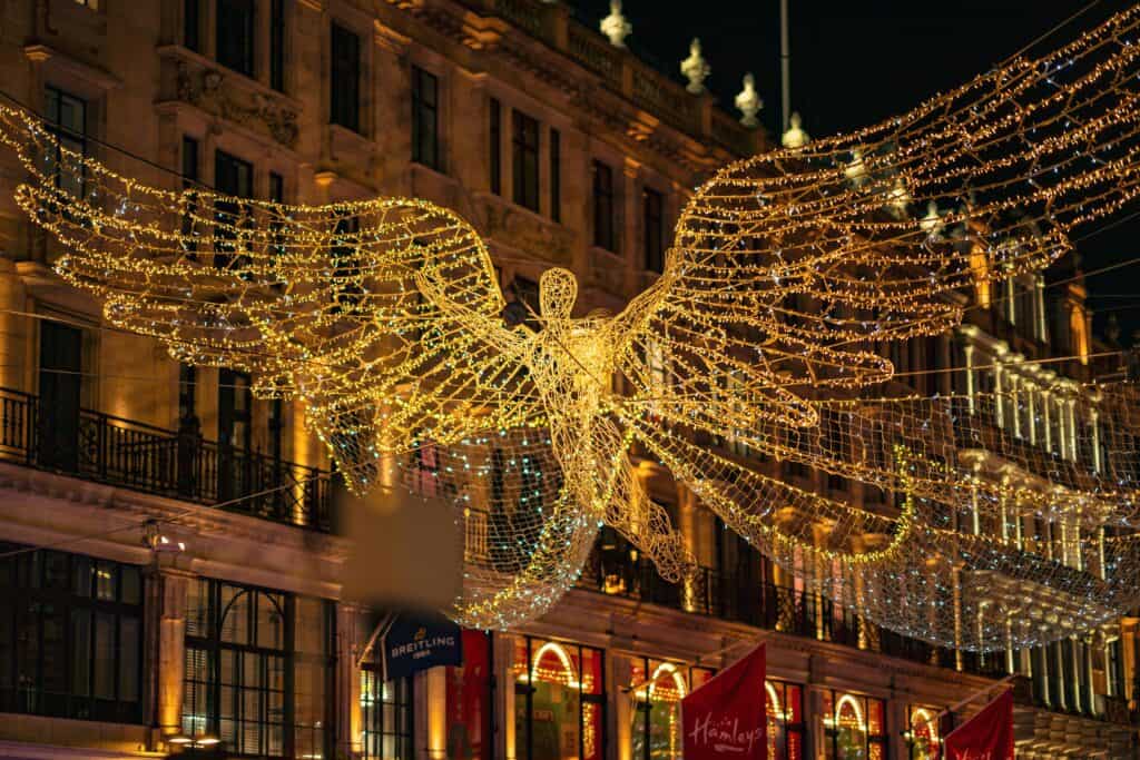 Regent Street’s angel Christmas lights shimmering above the crowds in central London