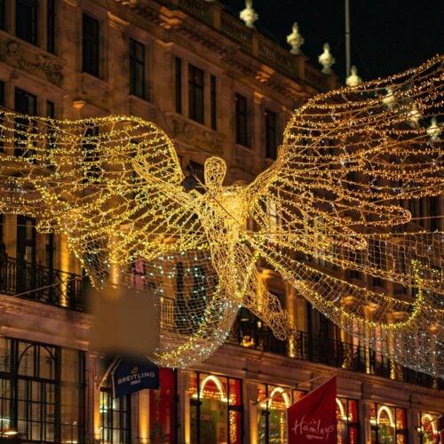 Regent Streetâs angel Christmas lights shimmering above the crowds in central London
