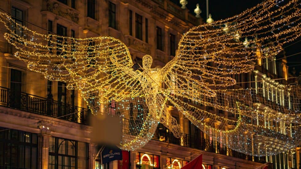Regent Street’s angel Christmas lights shimmering above the crowds in central London