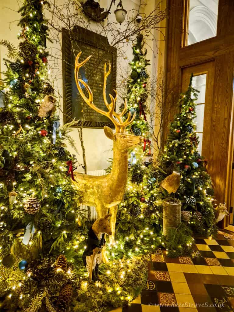 Close-up of golden reindeer and Christmas tree decorations in a hotel in Edinburgh.