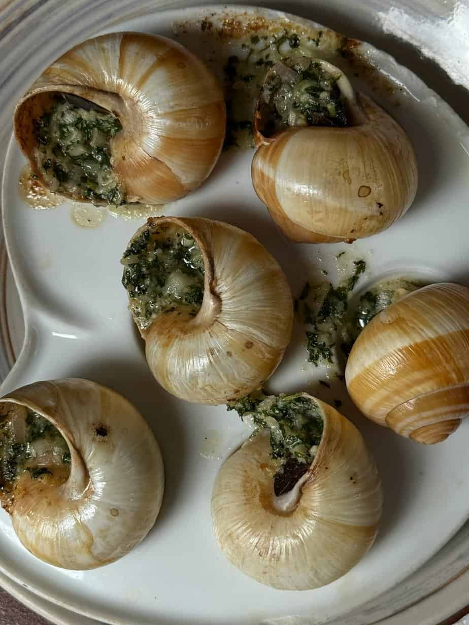 Escargots de Bourgogne, Paris — Traditional French snails baked with garlic and parsley butter served in their shells.