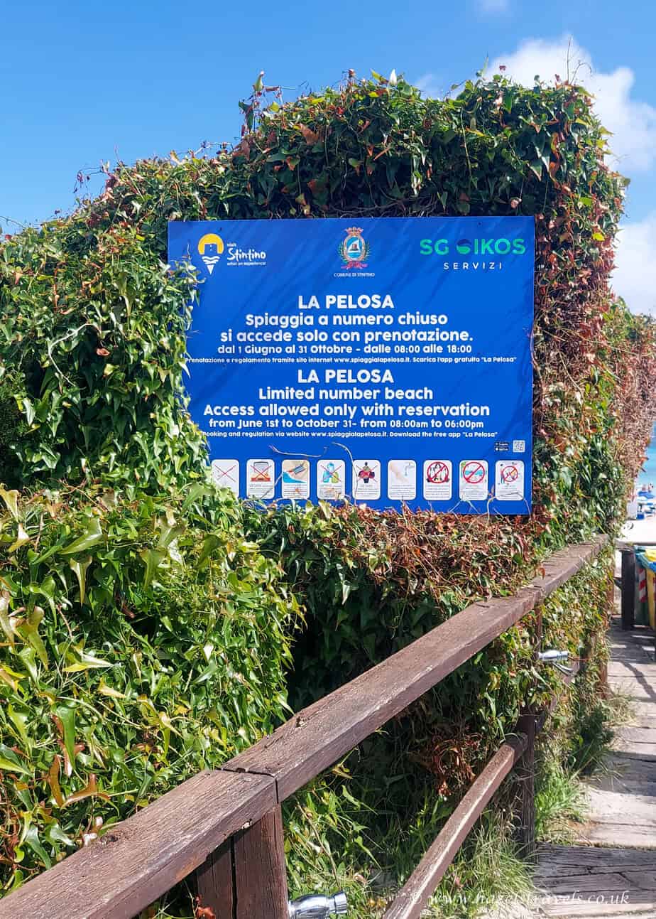La Pelosa Beach rules sign, Sardinia - Entrance sign listing beach regulations and eco-protection rules at La Pelosa.
