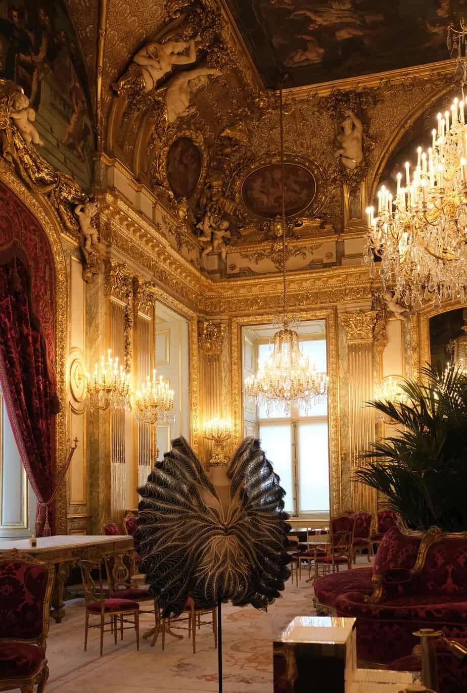 Napoleon III Apartments, Louvre Museum — Lavish interior with chandeliers and gilded décor.