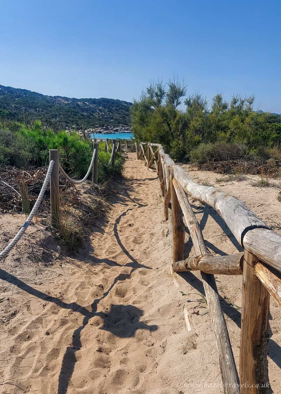 Beach in La Maddalena, Sardinia. Light coloured sand with ropes leading down to the beach