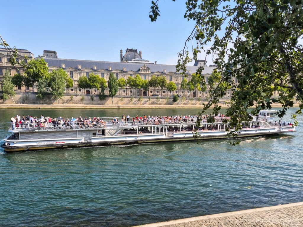 River Seine, Paris — View across the Seine with tree-lined banks and classic Parisian architecture.