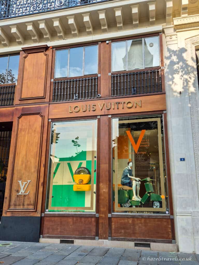 Luxury boutique, Saint-Germain-des-Prés, Paris - Designer shop window (Louis Vuitton) featuring handbags and accessories in the Saint-Germain district.