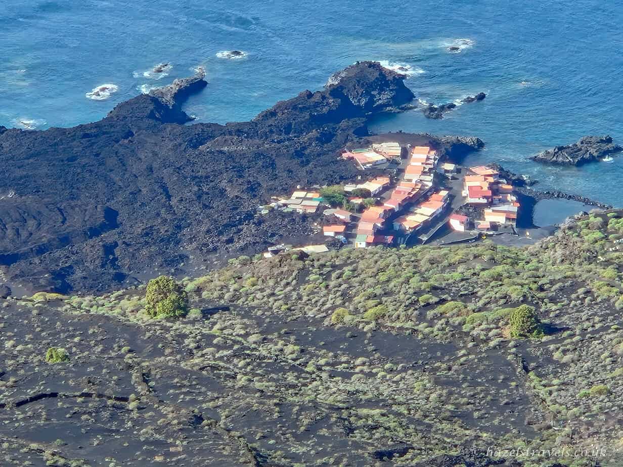 Village on the La Palma coastline partly covered by lava from the 2021 volcanic eruption.