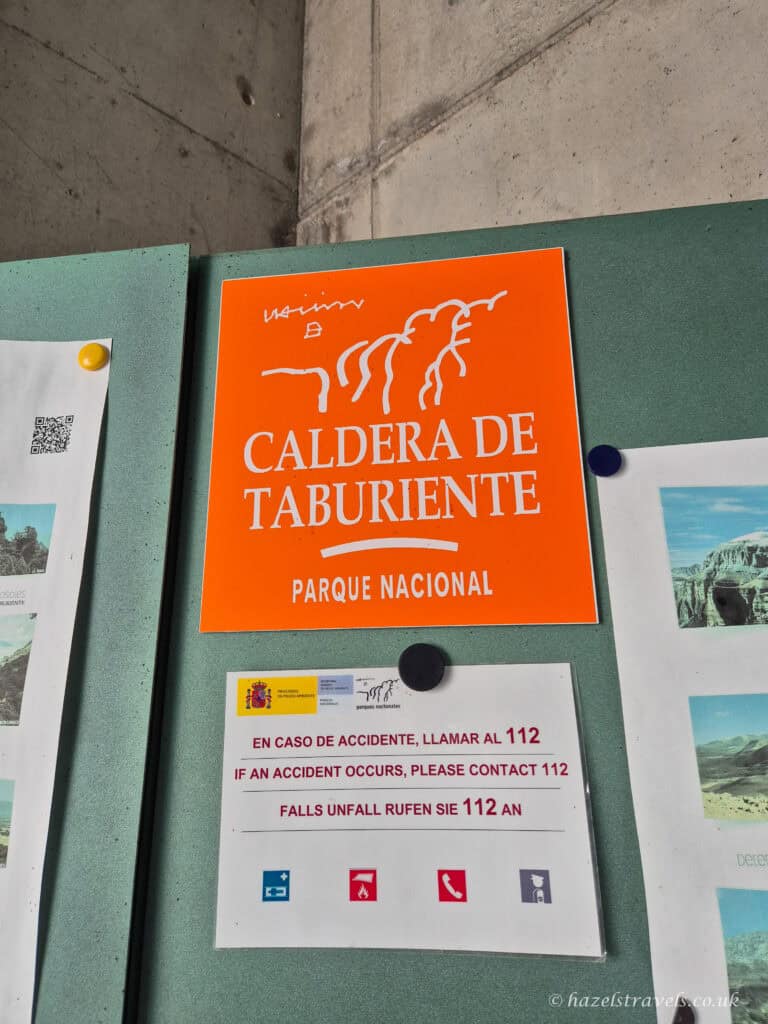 Information board for Caldera de Taburiente National Park in El Paso, La Palma, showing the official park sign and visitor details.