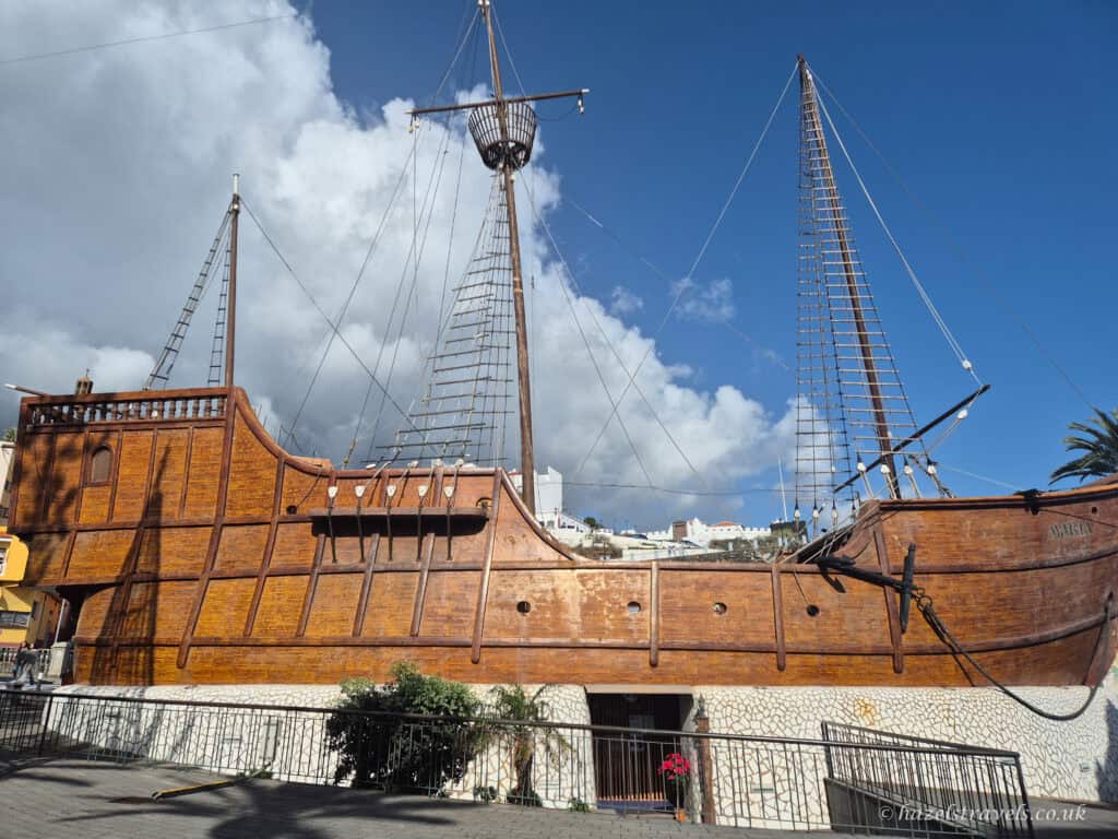 Replica of Christopher Columbus’s ship Santa Maria in Santa Cruz de La Palma’s nautical museum under blue skies.