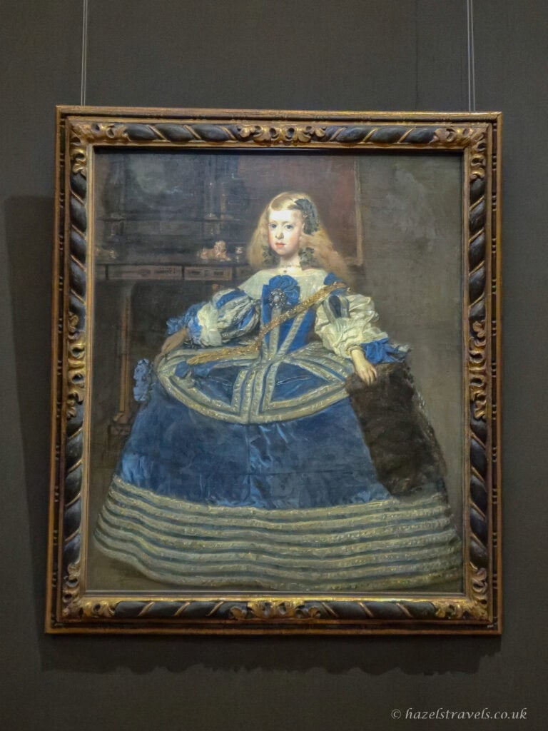 Diego Velázquez’s portrait painting of Infanta Margarita Teresa in a blue dress, showing the young Spanish princess in an elaborate court gown.