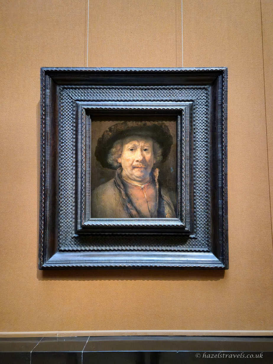 Rembrandt’s “Small Self-Portrait”, showing the artist wearing a hat and looking directly at the viewer.