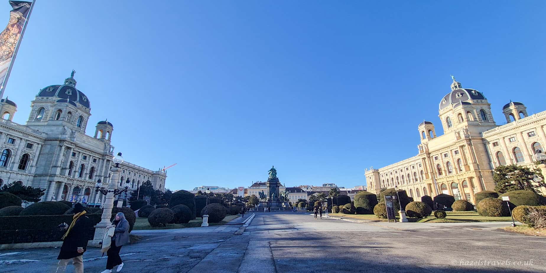 Maria-Theresien-Platz in Vienna with the Kunsthistorisches Museum visible across the open square on a clear blue day.