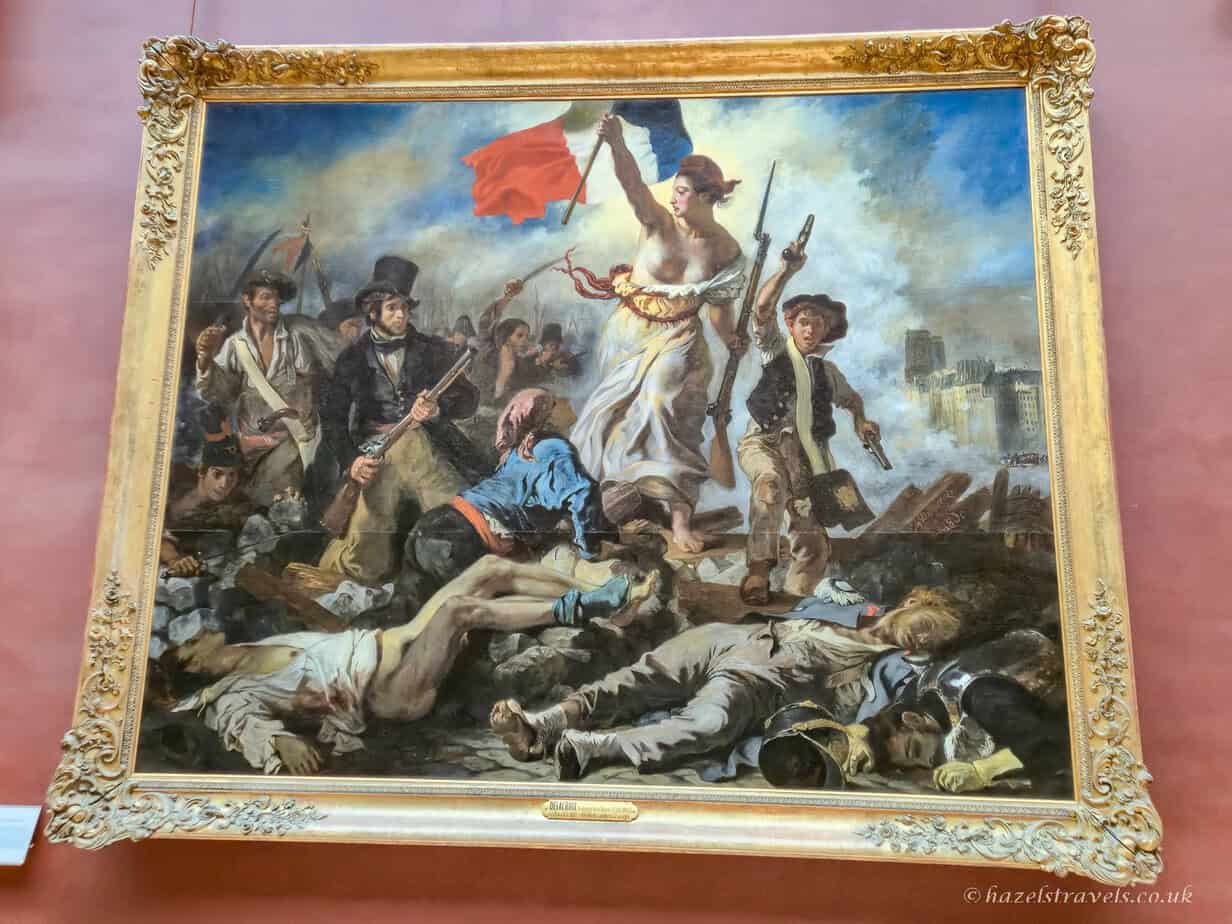 Liberty Leading the People by Eugène Delacroix – a powerful and emotional symbol of revolution and national pride, displayed at the Louvre Paris