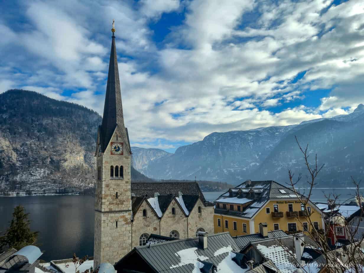 The iconic spire of Hallstatt’s Evangelical Church rising above the village beside Lake Hallstatt.